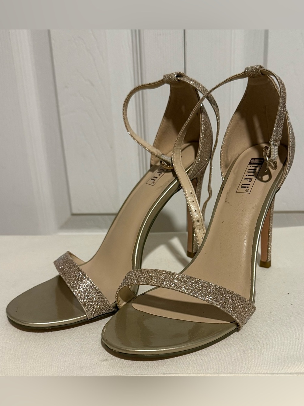 IDIFU Glitter Ankle-Strap Stiletto Sandals in Champagne Gold